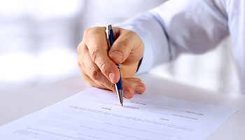 Businessman is signing a contract, business contract details